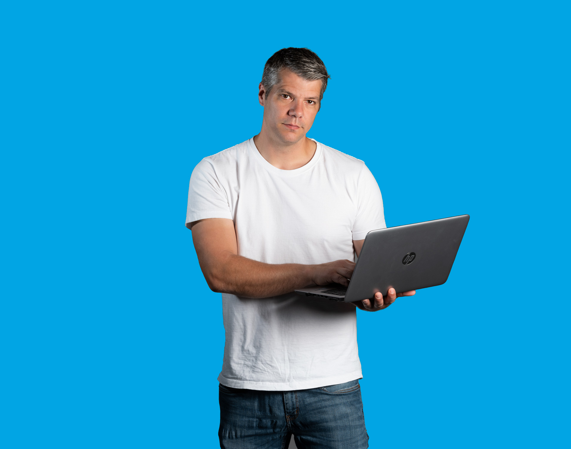 Metracon customer service manager holding laptop